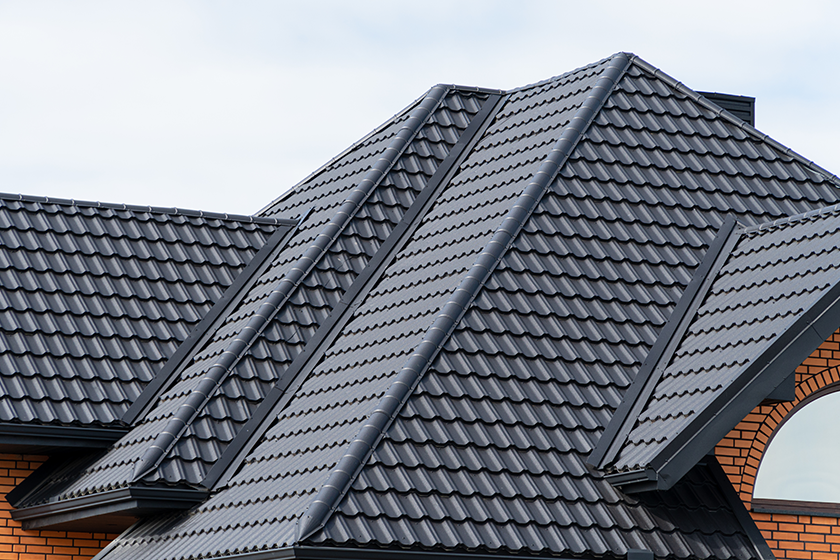 House with a black metal roof.